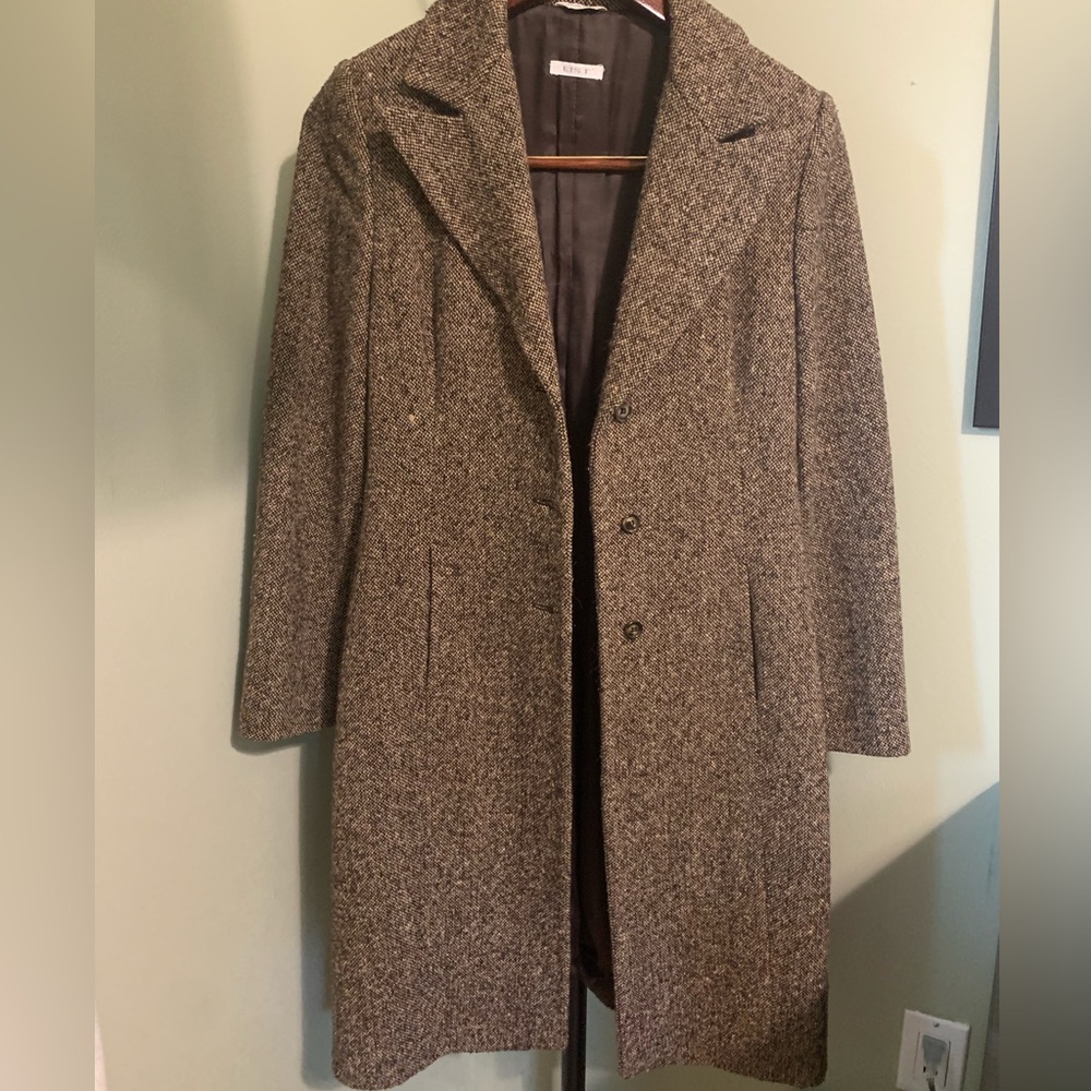 List brand coat with adorable brown ribbon tie.
